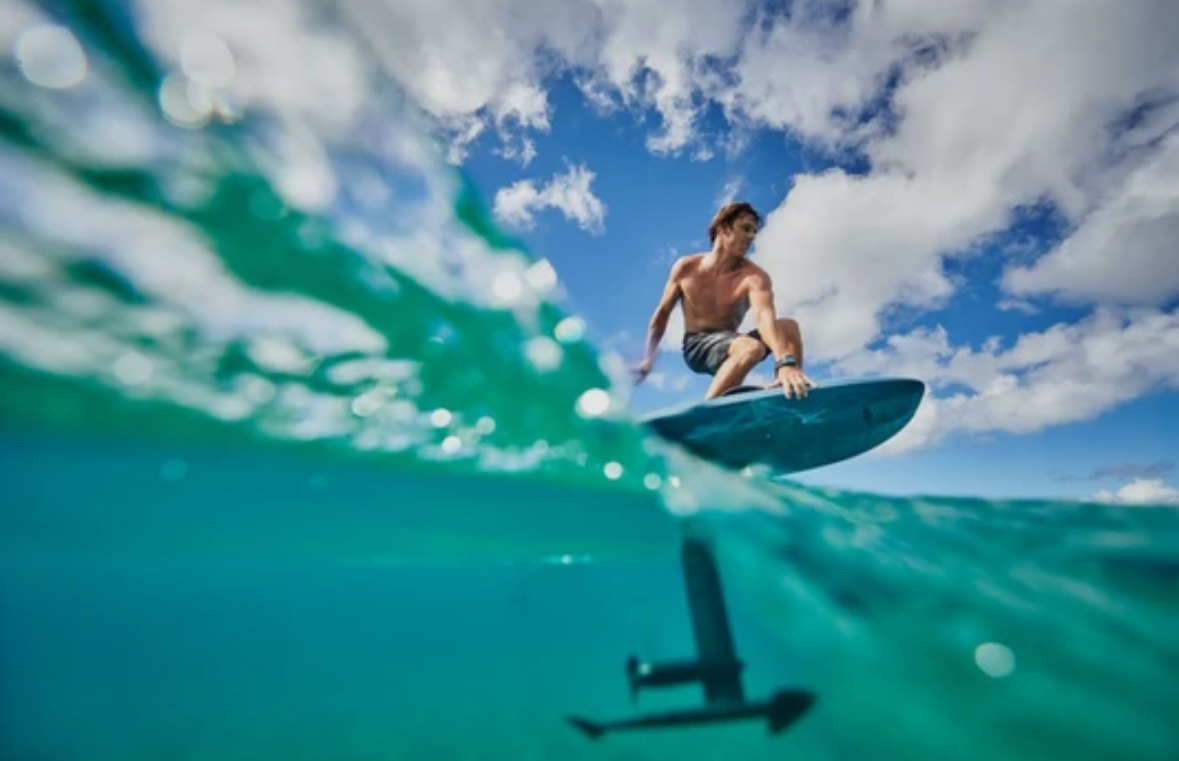 eFoil rider above turquoise Caribbean water